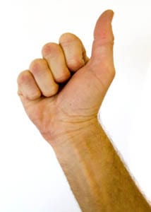 curl fingers in tightly, rolling in from the finger tips to form the basis of a proper "fighting fist"